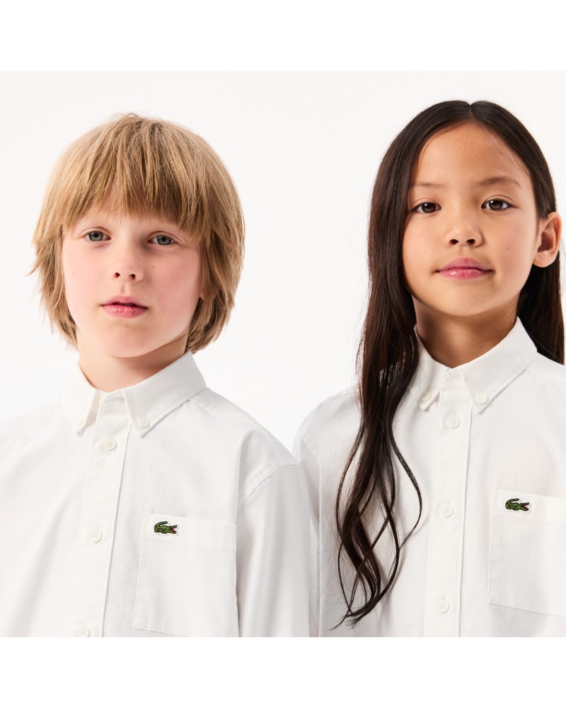 Chemise enfant Lacoste avec poches contrastées sur le devant